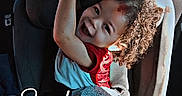 Christian joined the competition — help win amazing prizes! blanket, car_interior, car_seat, child, clothing, curly_hair, daytime, happy, indoors, parking_lot, person, photography, playful, seatbelt, sippy_cup, smiling, text_overlay, toddler, vehicle, window