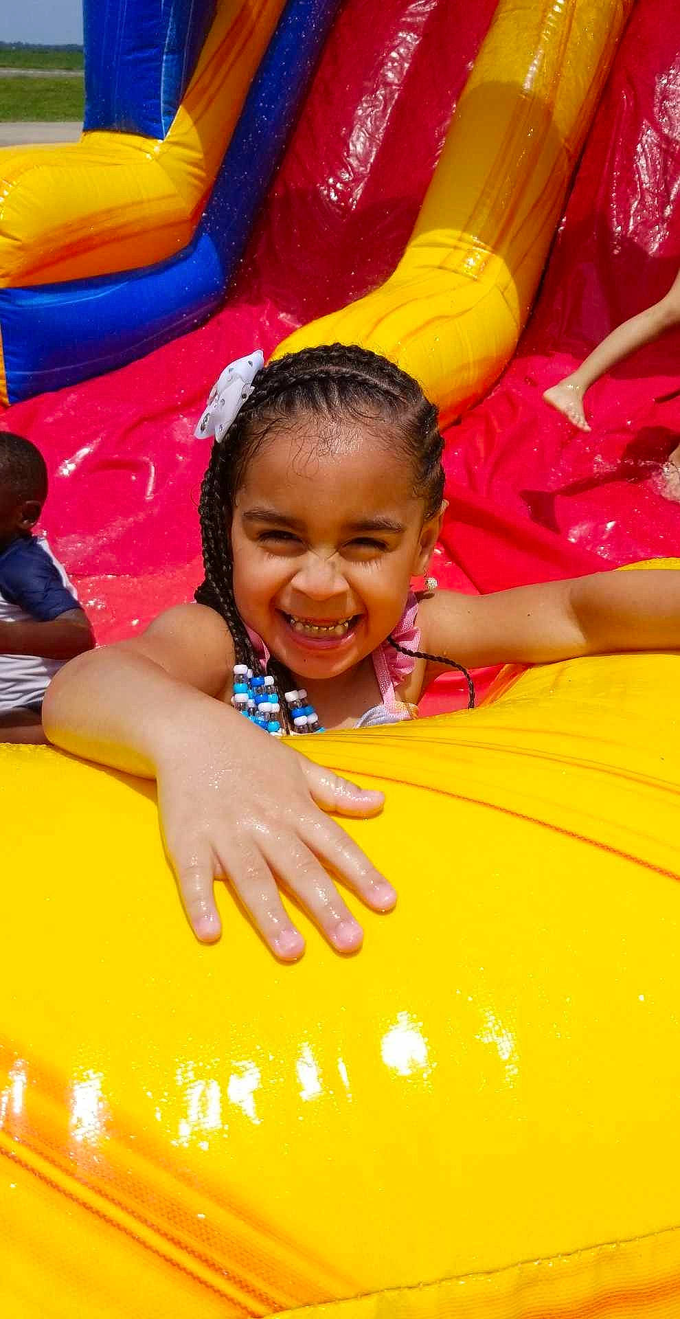 Anarii is registered to the contest to win money with this photo: amusement_park, bounce_house, child, event, fun, hair, happy, joy, laugh, leisure, nonbuilding_structure, outdoor_play_equipment, person, play, playground, recreation, red, smile, t_shirt, toddler