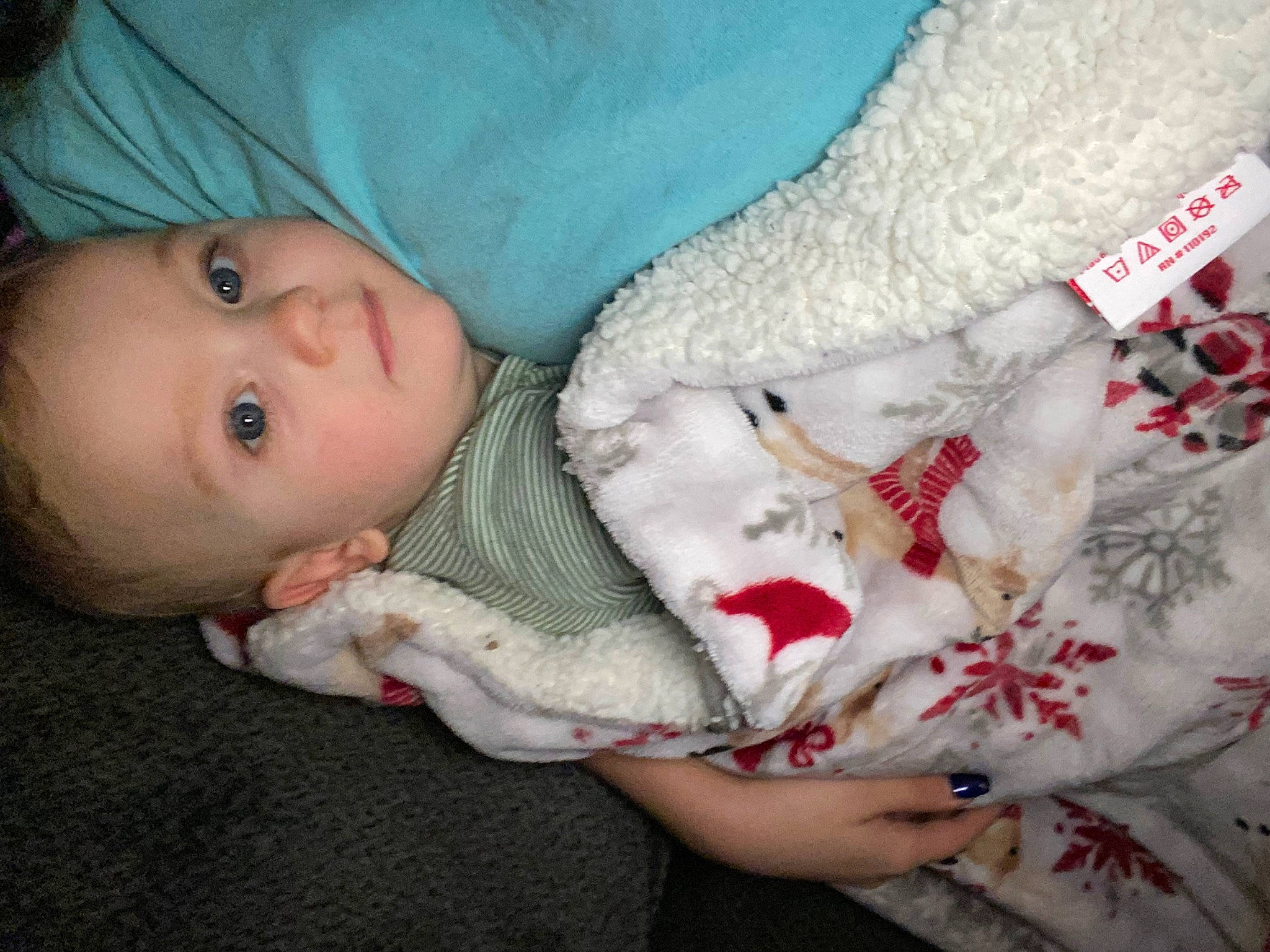 Mason is registered to the contest to win money with this photo: baby, baby_toddler_clothing, carmine, cheek, child, close_up, comfort, eye, fur, head, linens, mammal, outerwear, pattern, person, room, skin, sleeve, textile, toddler