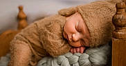 Ryker is registered to the contest to win money with this photo: baby, brown_clothing, child, closeup, cozy, cute, hat, indoors, infant, knit_blanket, newborn, peaceful, portrait, resting, sleeping, snug, soft_texture, tiny_hands, warm_colors, wooden_cradle