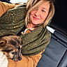 Alba a rejoint le concours — aidez-le/la à gagner de superbes lots ! woman, puppy, dog, pet, car, car_interior, smiling, portrait, seated, blanket, scarf, coat, brown_clothing, blonde_hair, animal, furry, cute, companion, close_up, indoor