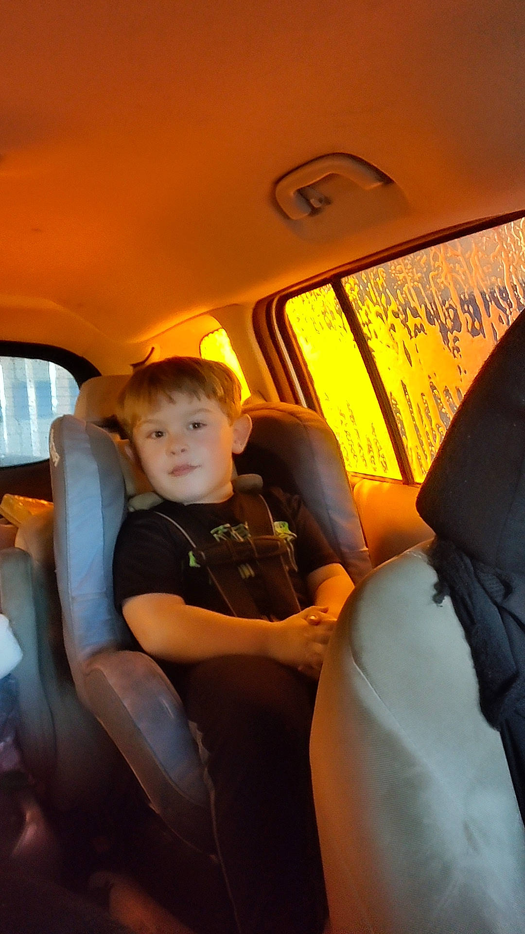 Devon is registered to the contest to win money with this photo: air_travel, auto_part, automotive_design, automotive_exterior, car, car_seat, car_seat_cover, comfort, family_car, fun, head_restraint, mode_of_transport, motor_vehicle, passenger, person, tints_and_shades, toddler, travel, vehicle, vehicle_door