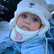 Cassie joined the competition — help win amazing prizes! baby, child, winter_clothing, hat, knitted_scarf, blue_jacket, outdoor, snow, cold_weather, cute, face, big_eyes, person, holding_hand, forest, tree, winter, warm_clothes, close_up, infant
