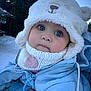 baby, child, winter_clothing, hat, knitted_scarf, blue_jacket, outdoor, snow, cold_weather, cute, face, big_eyes, person, holding_hand, forest, tree, winter, warm_clothes, close_up, infant