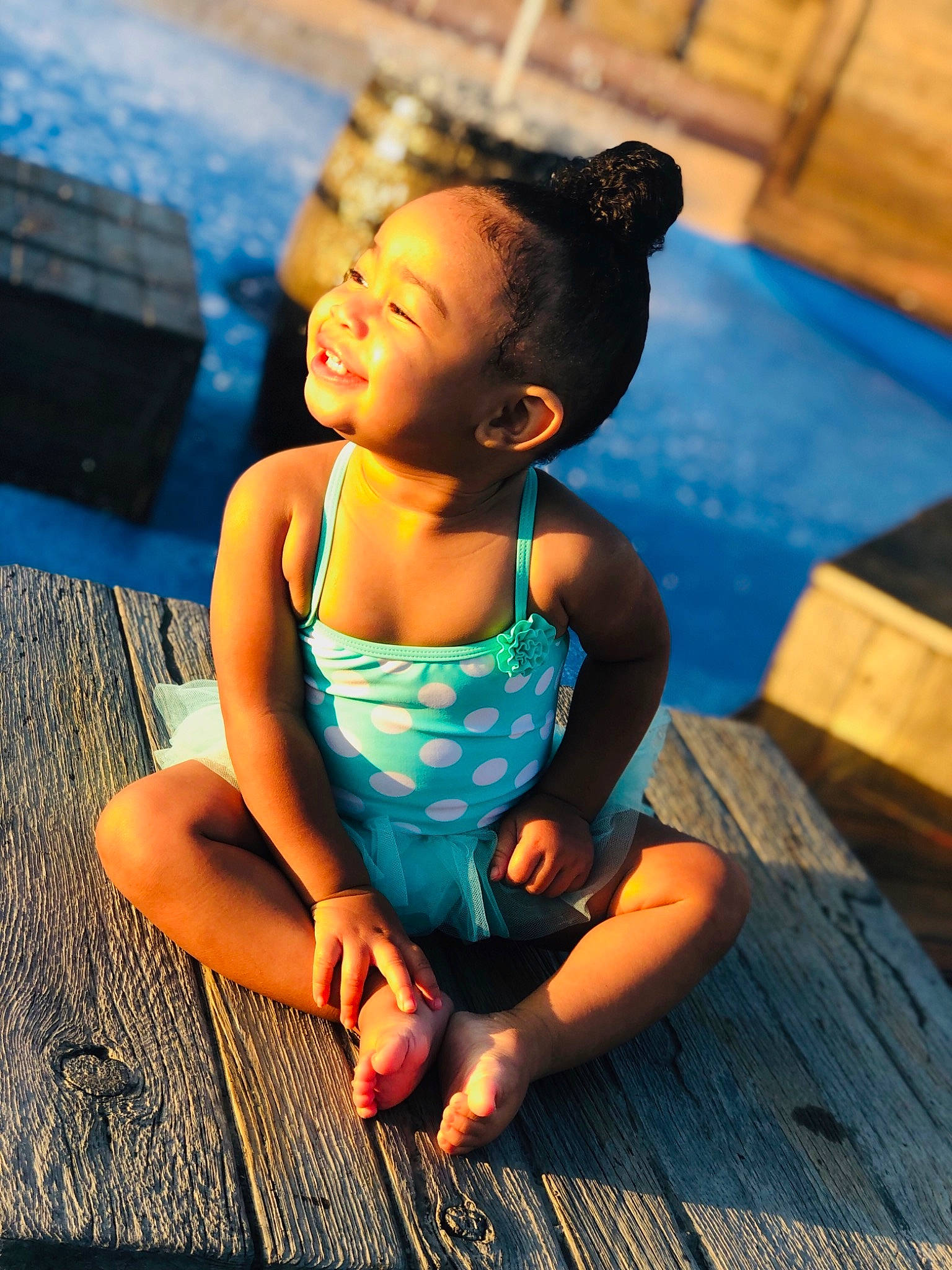 Breelle is registered to the contest to win money with this photo: baby, beauty, black_hair, blue, child, child_model, fun, happy, joy, leg, leisure, person, photography, play, recreation, sitting, smile, sportswear, summer, toddler