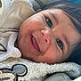 Gian is registered to the contest to win money with this photo: baby, smiling, face, closeup, blanket, mickey_mouse, clothing, child, happy, infant, texture, cozy, portrait, cushion, soft_light, indoors, cute, young_child, person, eyelashes