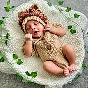 Yunay joined the competition — help win amazing prizes! baby, infant, knitted_clothing, lion_hat, blanket, ivy_leaves, cute, sleeping, cozy, soft, portrait, child, newborn, resting, indoor, baby_feet, baby_hands, warm_colors, texture, adorable