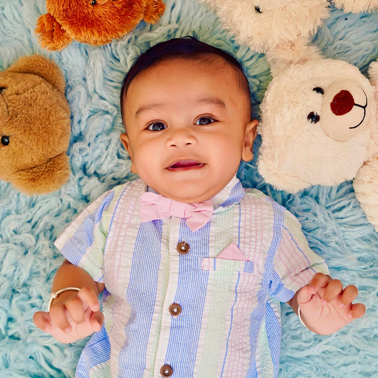 Yunay joined the competition — help win amazing prizes! adorable, baby, blue_rug, bow_tie, child, cozy, cute, happy, indoor, infant, lying_down, pastel_colors, person, playtime, plush_toy, portrait, smiling, soft_texture, striped_shirt, teddy_bear