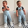 baby, black_tshirt, casual_clothing, child, cute, denim_overalls, footwear, furniture, happy, indoor, light, mickey_mouse, posing, smiling, striped_couch, toddler, two_shots, wall, white_sneakers, young_child