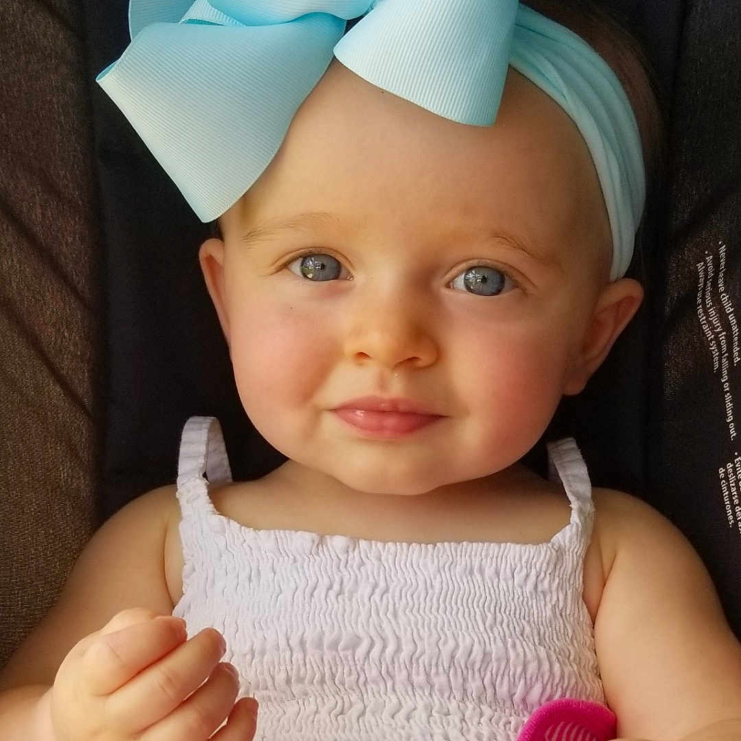 Elena joined the competition — help win amazing prizes! accessories, baby, bodypart, clothing, couch, cushion, dress, face, finger, furniture, hand, happy, hat, head, headband, newborn, person, photography, portrait, smile