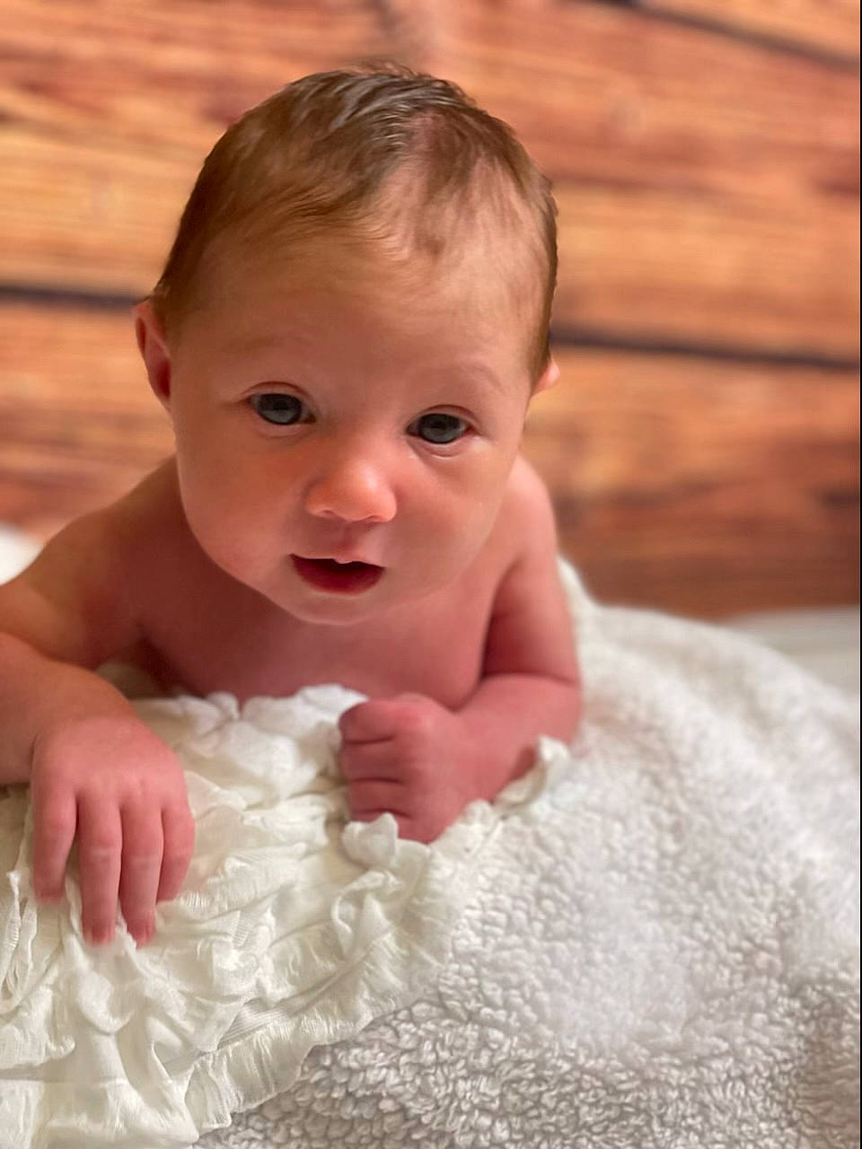 Emilia is registered to the contest to win money with this photo: baby, baby_toddler_clothing, bathing, cheek, chest, child, comfort, dress, eyelash, flash_photography, flooring, gesture, hand, happy, person, portrait_photography, sitting, smile, thumb, toddler