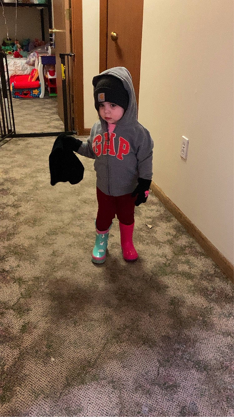 Isabella is registered to the contest to win money with this photo: baby, baby_toddler_clothing, cap, child, floor, flooring, fun, grass, hat, headwear, luggage_and_bags, magenta, person, pink, play, room, shadow, sleeve, sneakers, standing