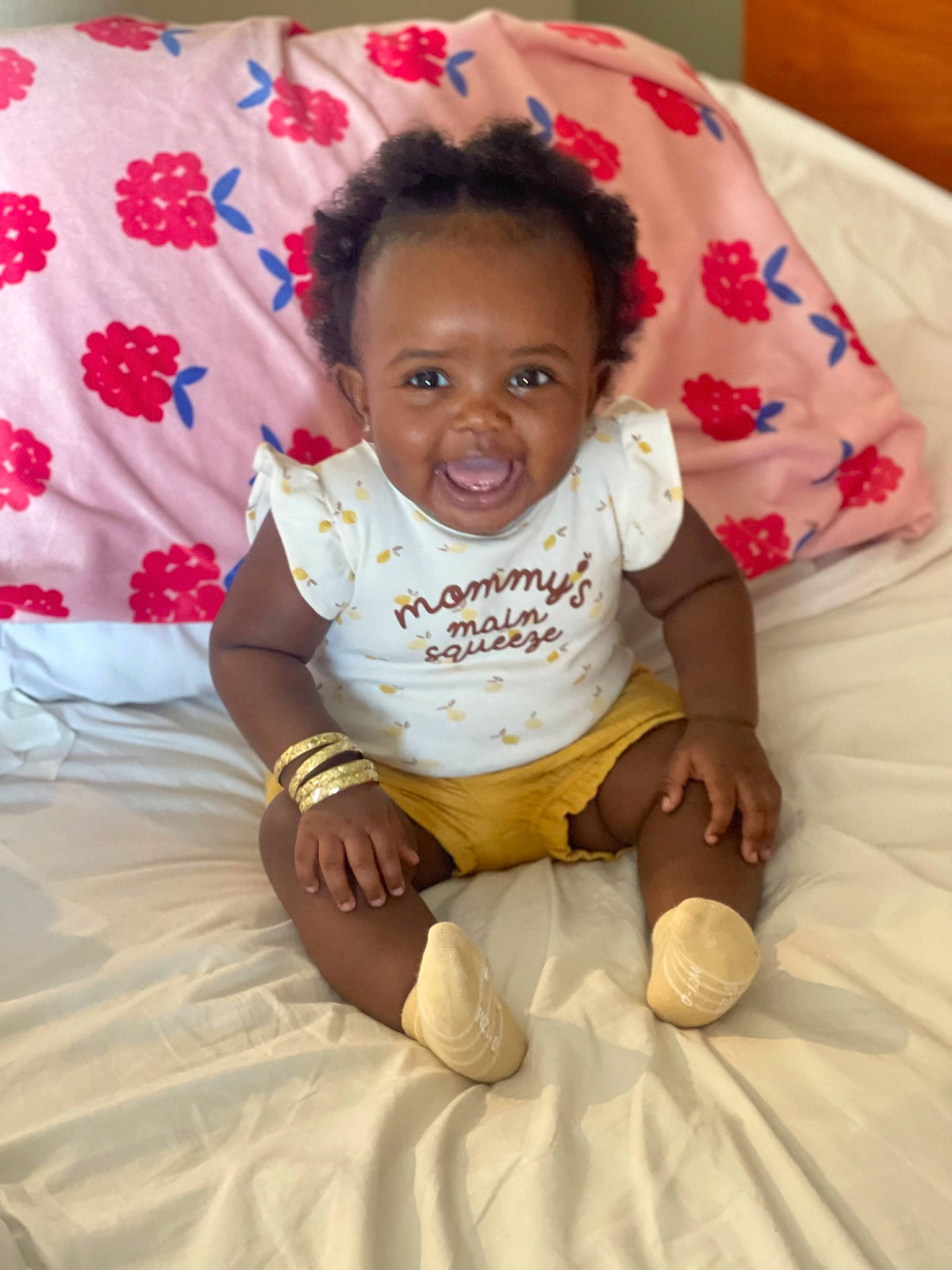 Jourdyn is registered to the contest to win money with this photo: baby, baby_toddler_clothing, cheek, child, comfort, eye, face, finger, foot, fun, happy, head, linens, person, pink, sitting, skin, sleeve, smile, t_shirt
