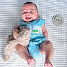 Lowen joined the competition — help win amazing prizes! baby, infant, smiling, teddy_bear, blue_outfit, blanket, milestone_marker, four_months, cute, child, lying_down, soft_toy, portrait, happy, skin, feet, clothing, head, person, indoor