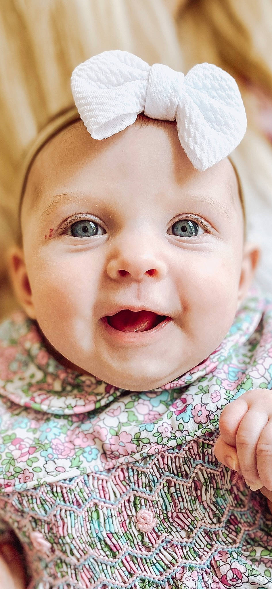 Isabella is registered to the contest to win money with this photo: baby, baby_toddler_clothing, cap, cheek, chin, eye, eyebrow, face, happy, headwear, iris, lip, mouth, nose, person, pink, plant, skin, sleeve, smile