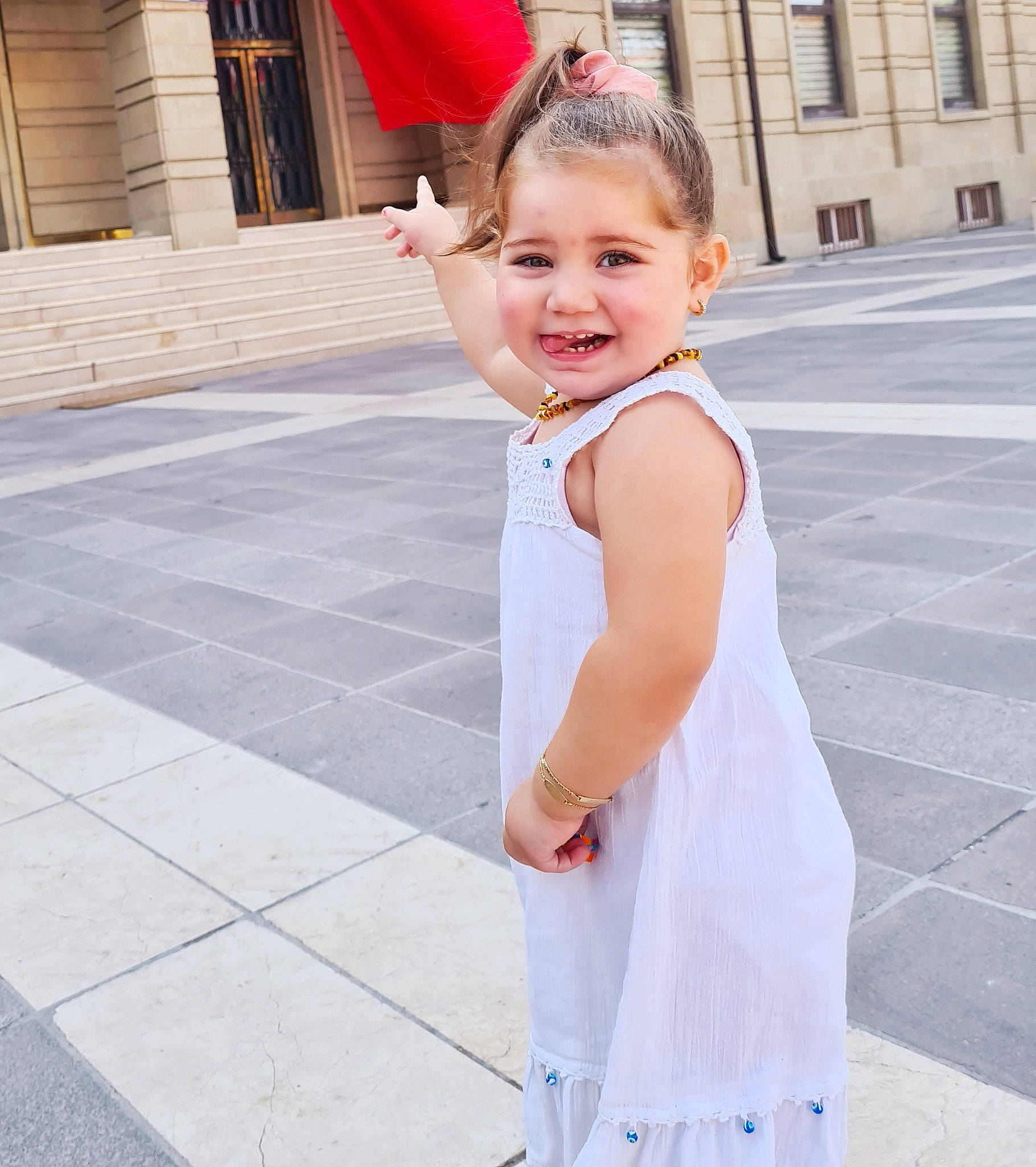 Lina participe au concours pour gagner de l'argent avec cette photo : asphalt, baby, baby_toddler_clothing, day_dress, dress, face, facial_expression, fun, gesture, happy, joint, joy, person, pink, recreation, sleeve, smile, snapshot, street_fashion, toddler