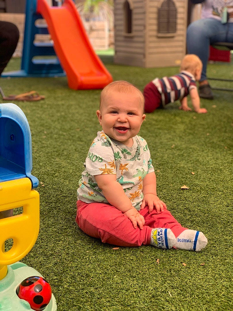 Aidyn is registered to the contest to win money with this photo: baby, baby_toddler_clothing, child, chute, city, event, flooring, fun, games, grass, happy, joy, leisure, person, playground, recreation, red, shorts, smile, toddler