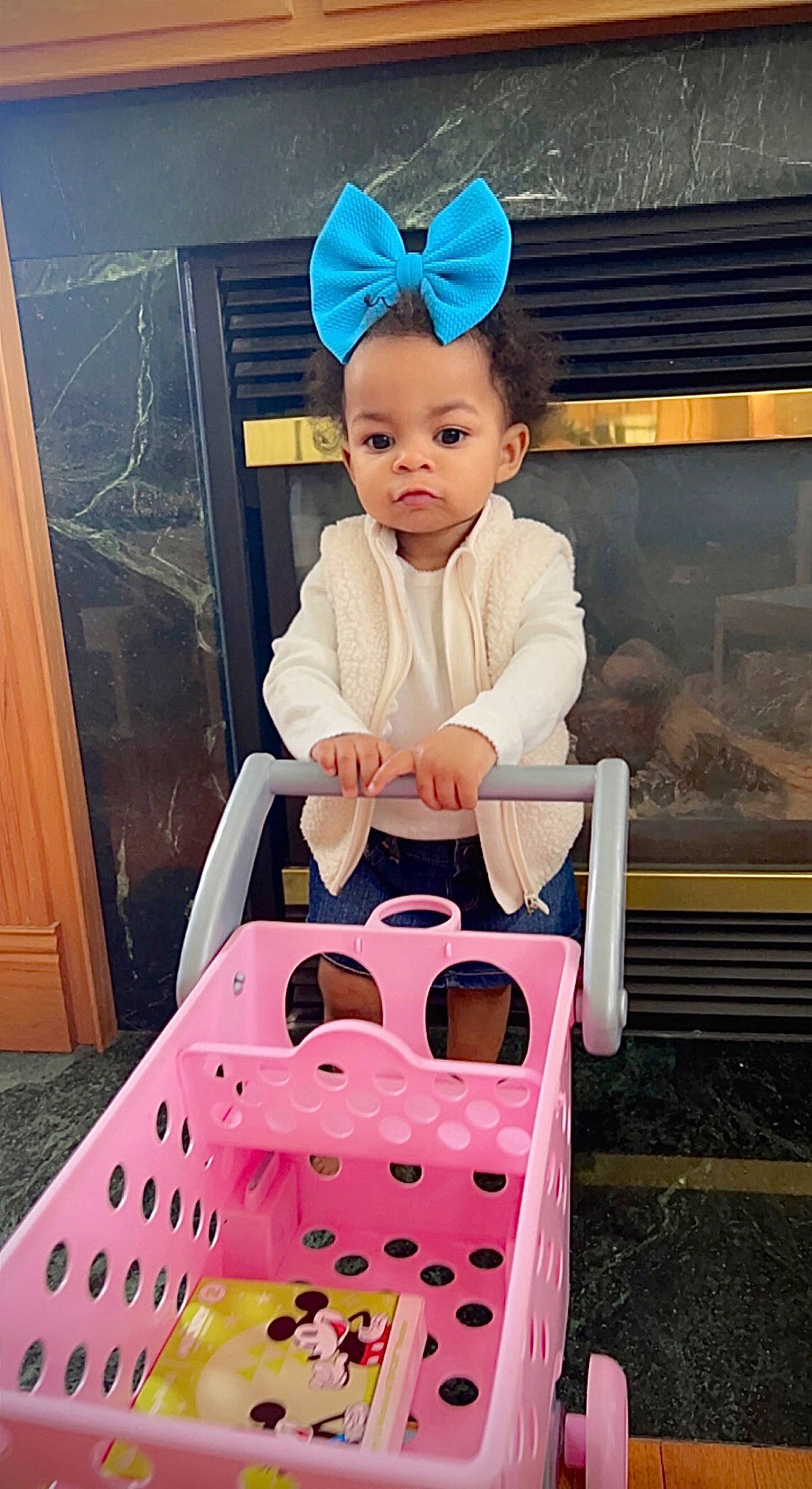 Briella is registered to the contest to win money with this photo: baby, baby_products, baby_toddler_clothing, beauty, child, costume_hat, door, fashion_accessory, fun, happy, magenta, pattern, person, photograph, pink, recreation, sitting, sleeve, t_shirt, toddler