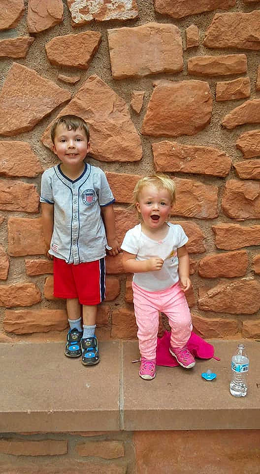 Malachi is registered to the contest to win money with this photo: child, fun, happy, joy, person, play, sibling, standing, toddler, vacation, wall