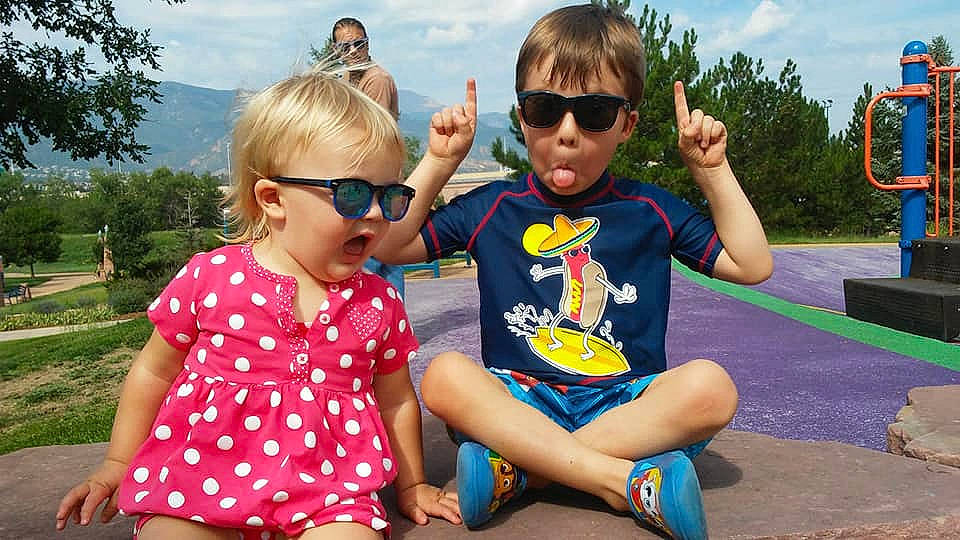 Malachi is registered to the contest to win money with this photo: child, cool, daughter, eyewear, family, fun, glasses, grass, happy, leisure, people, person, personal_protective_equipment, plant, play, recreation, summer, sunglasses, toddler, tourism