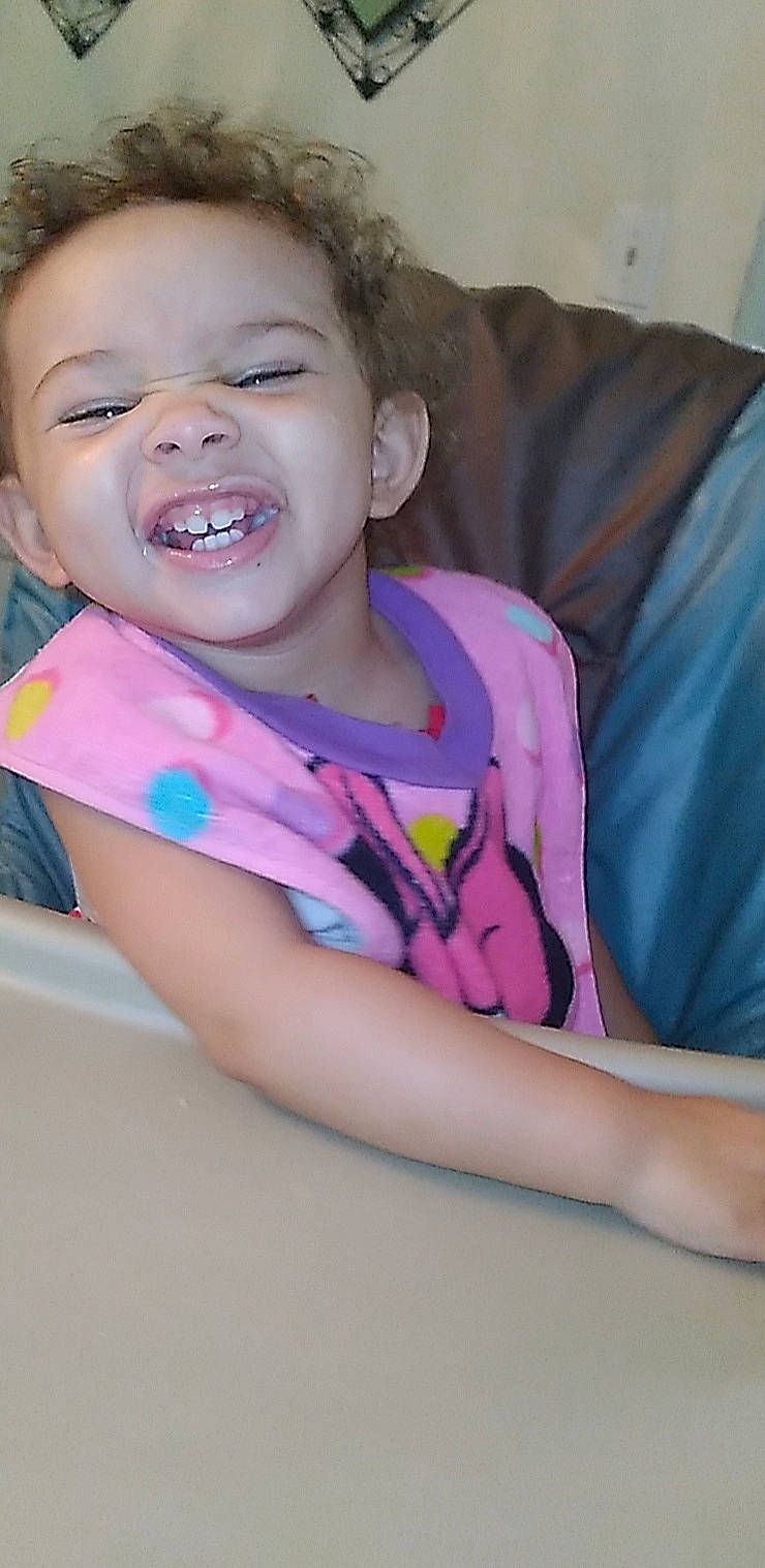 Lydia is registered to the contest to win money with this photo: cheek, comfort, eyebrow, eyelash, gesture, happy, iris, leisure, lip, magenta, mouth, neck, nose, person, pink, purple, skin, sleeve, smile, t_shirt