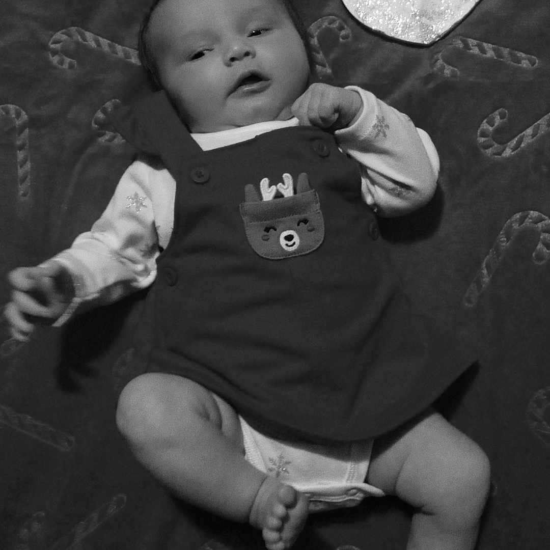 Eri Isabella is registered to the contest to win money with this photo: applique, baby, bodypart, clothing, diaper, face, finger, furniture, glove, hand, head, money, newborn, pattern, person, photography, portrait, shorts, sleeping, t_shirt