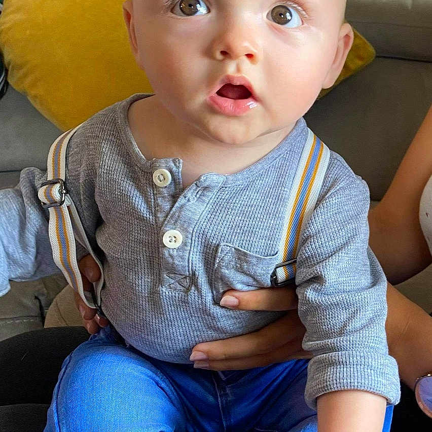 Rudi is registered to the contest to win money with this photo: baby, cheek, child, child_model, product, sitting, skin, smile, toddler