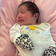 Analeia joined the competition — help win amazing prizes! baby, child, closeup, cute, human, indoors, infant, leopard_print, mittens, newborn, onesie, peaceful, pink_blanket, polka_dots, portrait, relaxed, sleeping, smile, soft_texture, white_clothing