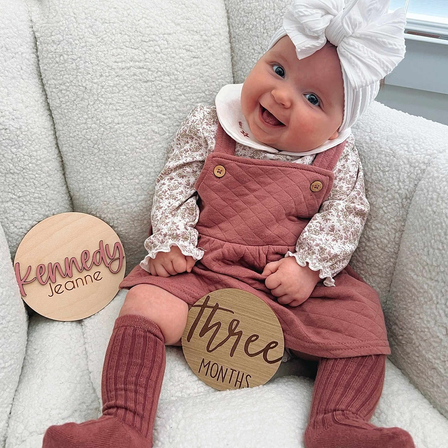 Kennedy is registered to the contest to win money with this photo: baby, babylaughing, bonnet, clothing, costume, couch, cushion, face, furniture, happy, hat, head, homedecor, hosiery, pants, person, photography, portrait, sitting, sock