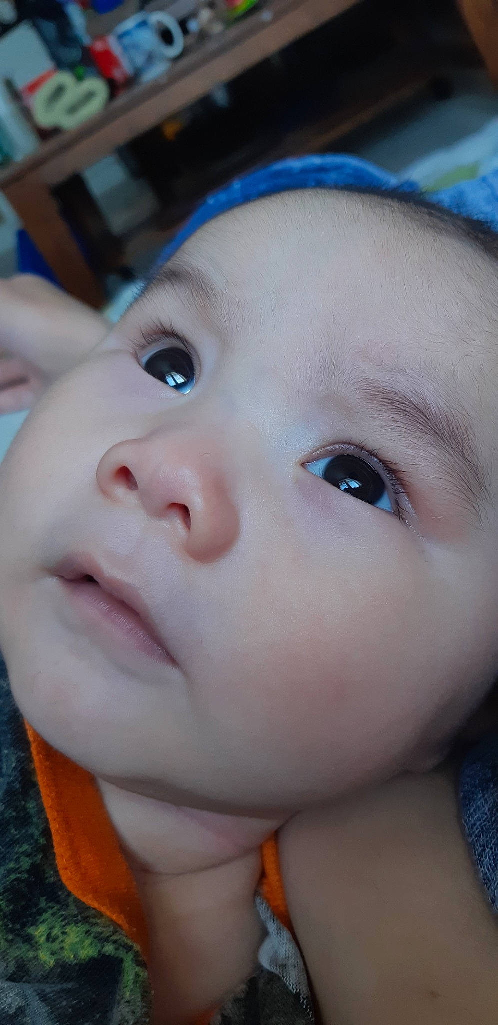 Johnny is registered to the contest to win money with this photo: baby, blue, cheek, chin, ear, eye, eyebrow, eyelash, facial_expression, forehead, gesture, happy, headwear, iris, lip, mammal, mouth, nose, person, skin