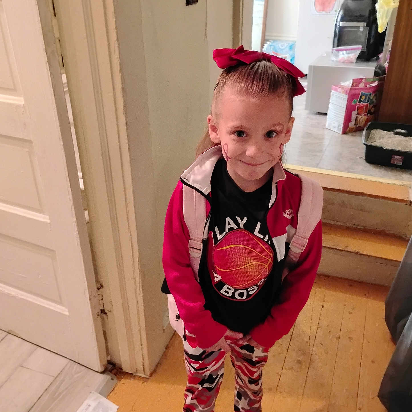 Rosie is registered to the contest to win money with this photo: ball, basketball, basketballball, child, clothing, door, face, female, girl, hardwood, head, indoors, interiordesign, knitwear, pants, person, photography, plywood, sport, wood