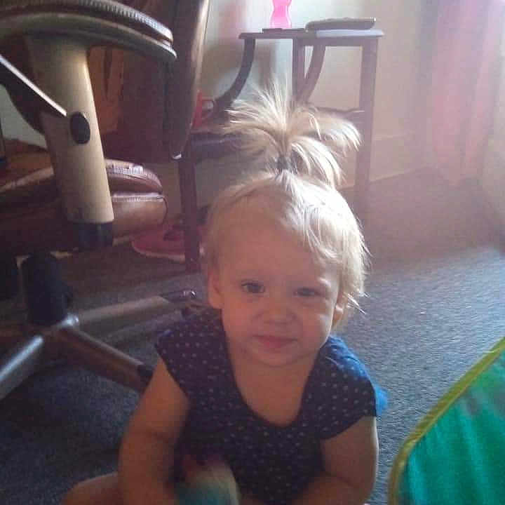 Rosalie Darlene is registered to the contest to win money with this photo: baby, blonde, chair, clothing, diningtable, face, furniture, hair, head, homedecor, indoors, lighting, person, photography, plant, portrait, pottedplant, sitting, t_shirt, table