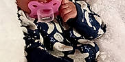 Unique is registered to the contest to win money with this photo: baby, sleeping, pacifier, hat, blanket, cozy, infant, cute, child, soft, warm, hand, face, clothing, pattern, star, newborn, rest, comfort, indoors