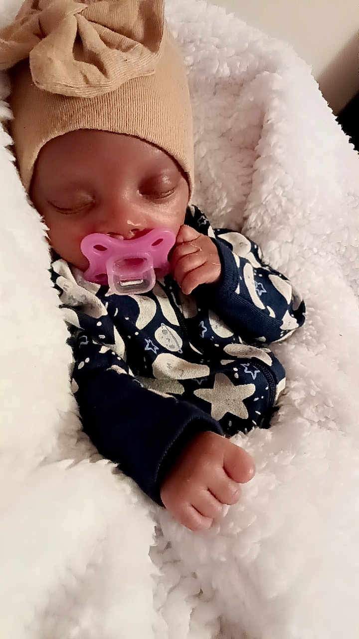 Unique is registered to the contest to win money with this photo: baby, sleeping, pacifier, hat, blanket, cozy, infant, cute, child, soft, warm, hand, face, clothing, pattern, star, newborn, rest, comfort, indoors