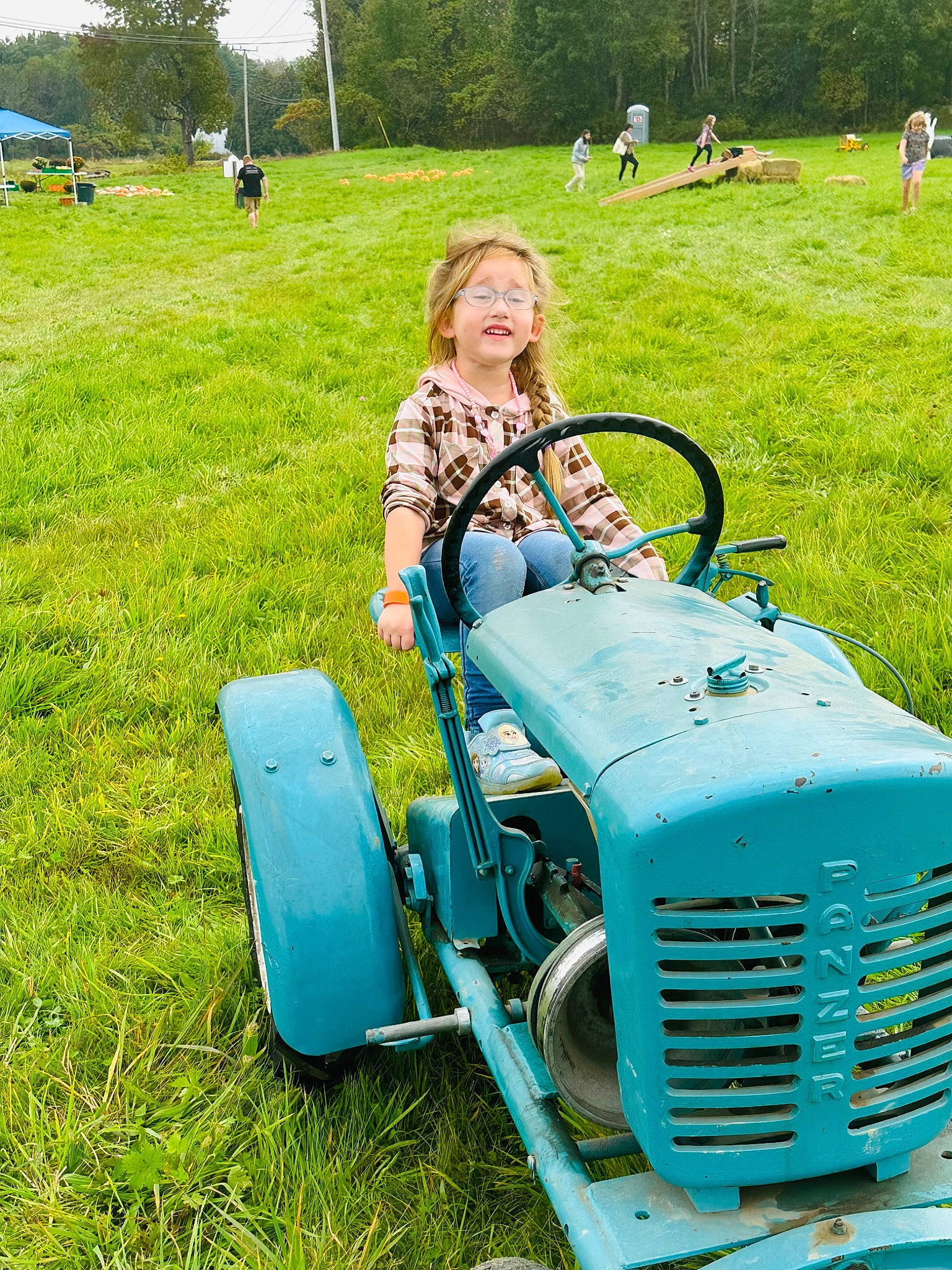 Heaven joined the competition — help win amazing prizes! agricultural_machinery, automotive_design, automotive_tire, automotive_wheel_system, classic, fender, grass, grass_family, grassland, green, lawn, machine, motor_vehicle, person, plant, smile, tire, tractor, tree, vehicle