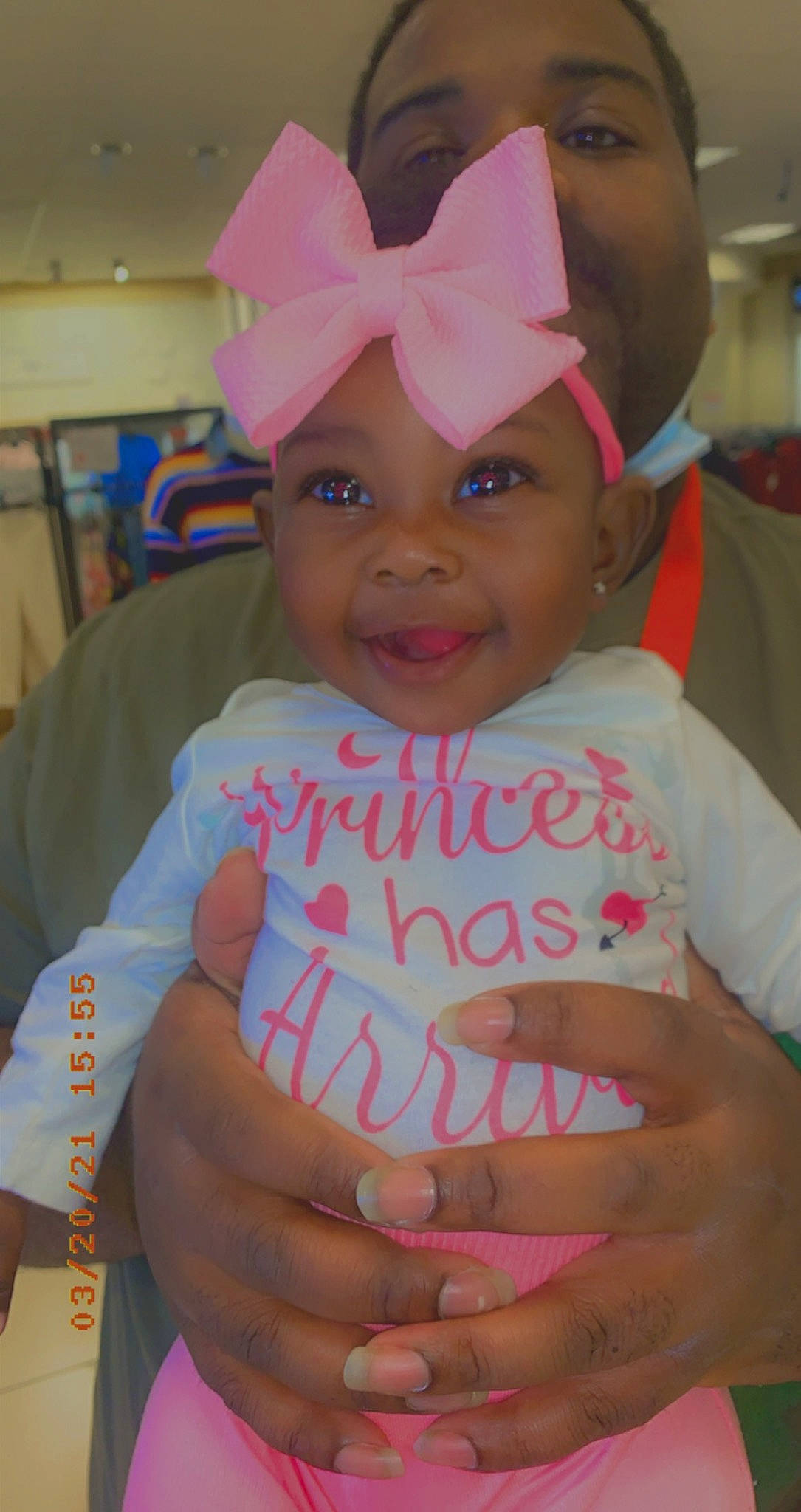 Kenslee is registered to the contest to win money with this photo: baby, baby_toddler_clothing, cap, cheek, child, costume_hat, event, facial_expression, finger, gesture, happy, headwear, joy, organ, people, person, pink, skin, smile, thumb