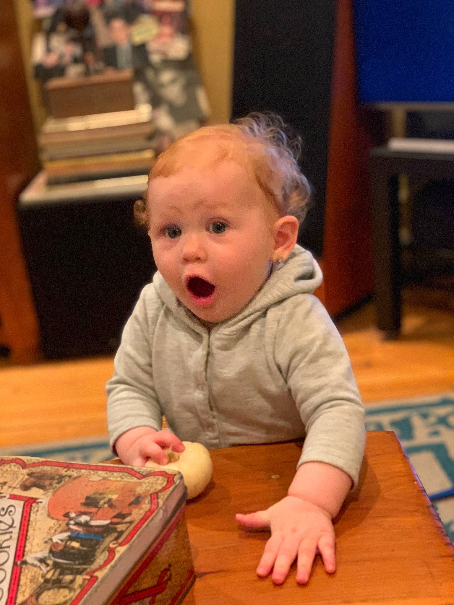 Ember joined the competition — help win amazing prizes! baby, baby_toddler_clothing, cheek, child, event, floor, flooring, fun, hardwood, people, person, play, room, sitting, smile, surprise, table, toddler, varnish, wood