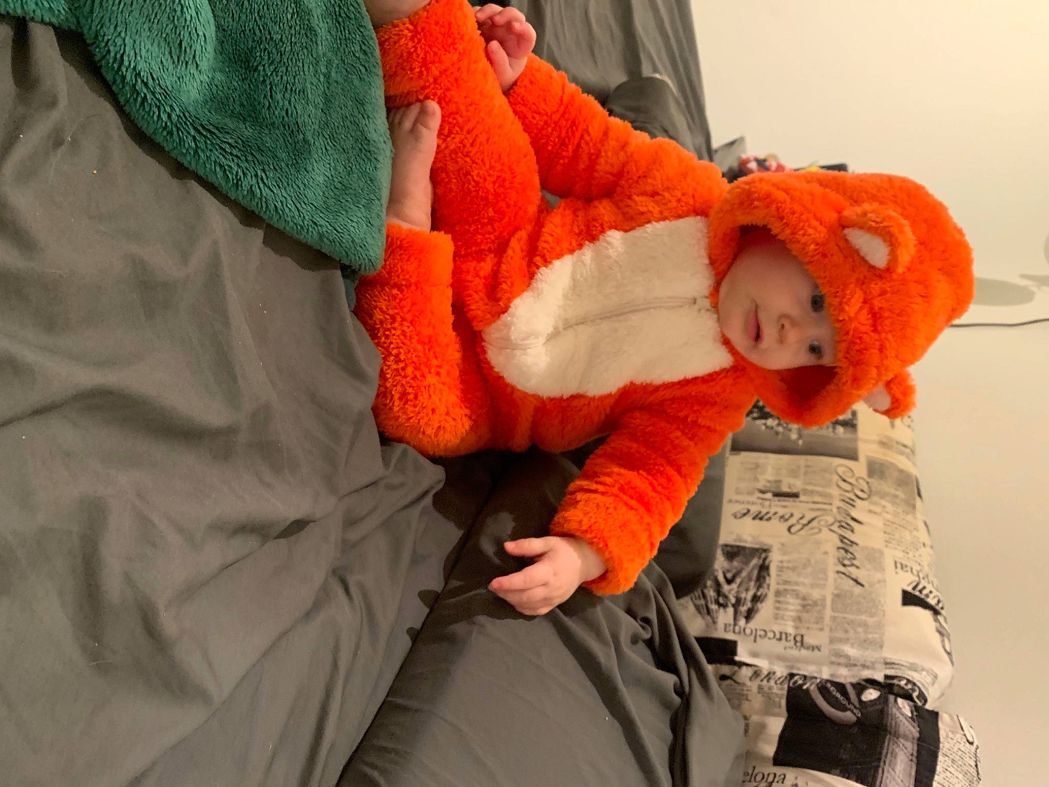 Ember joined the competition — help win amazing prizes! art, baby, baby_sleeping, baby_toddler_clothing, bed, bed_sheet, bedding, carmine, child, comfort, fur, headgear, headwear, linens, orange, person, pillow, red, room, stuffed_toy