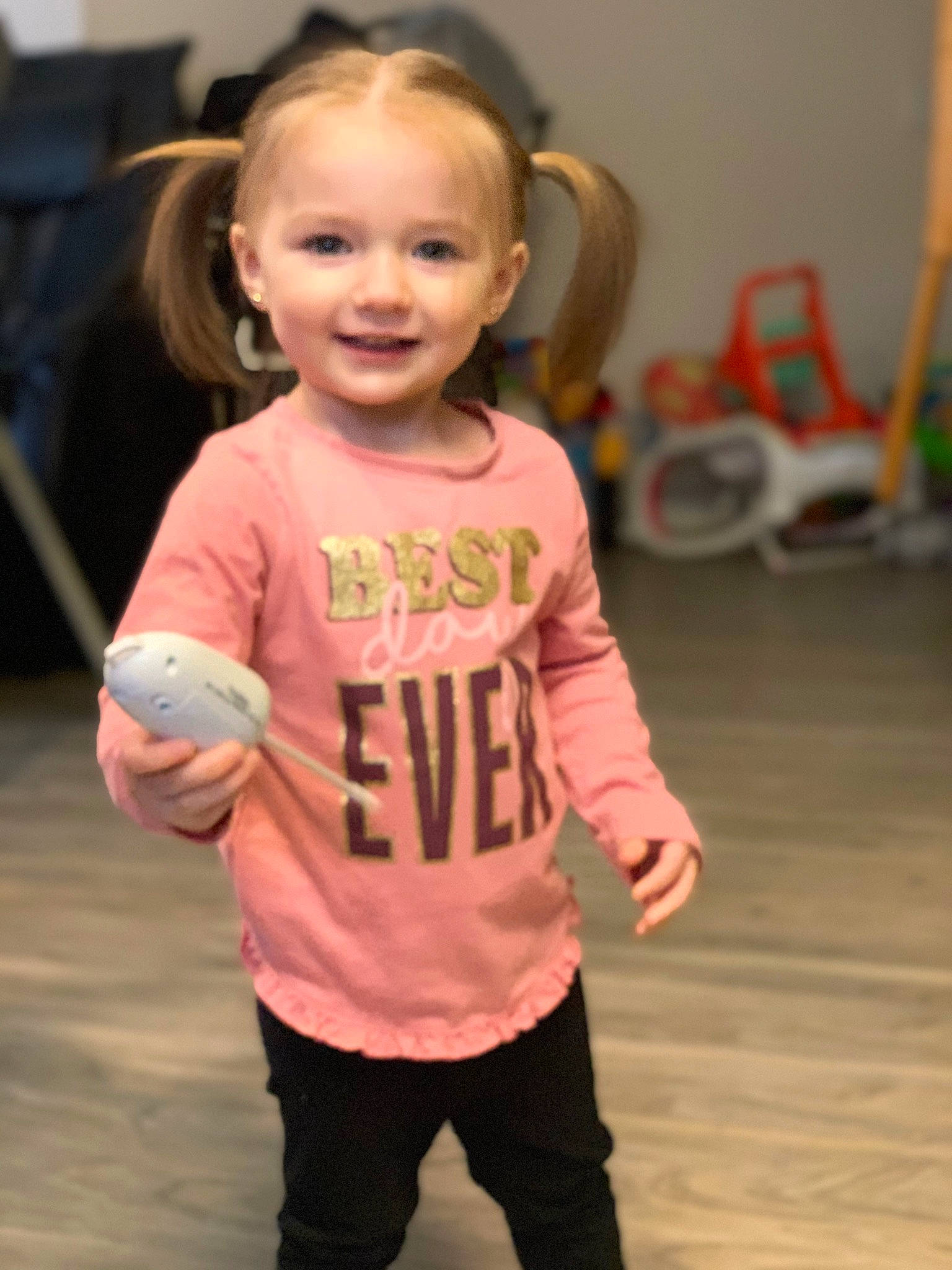 Ezlyn is registered to the contest to win money with this photo: arm, baby_toddler_clothing, chair, cheek, child, event, eye, face, flooring, fun, hair, hairstyle, happy, head, joy, person, skin, sleeve, smile, standing