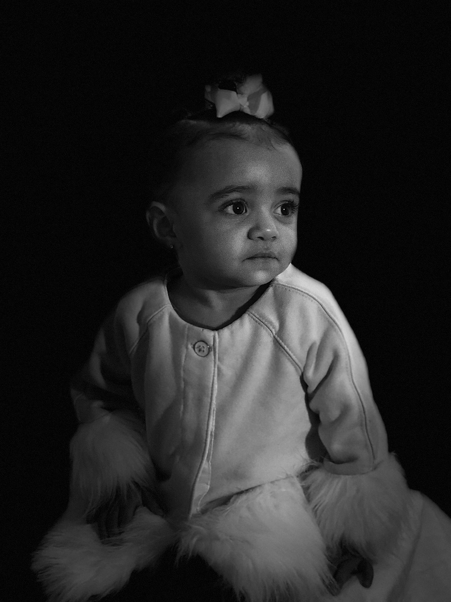 Mariyah is registered to the contest to win money with this photo: baby, black, black_and_white, cheek, child, darkness, flash_photography, human, monochrome, monochrome_photography, person, photograph, photography, portrait, portrait_photography, sitting, smile, standing, stock_photography, toddler