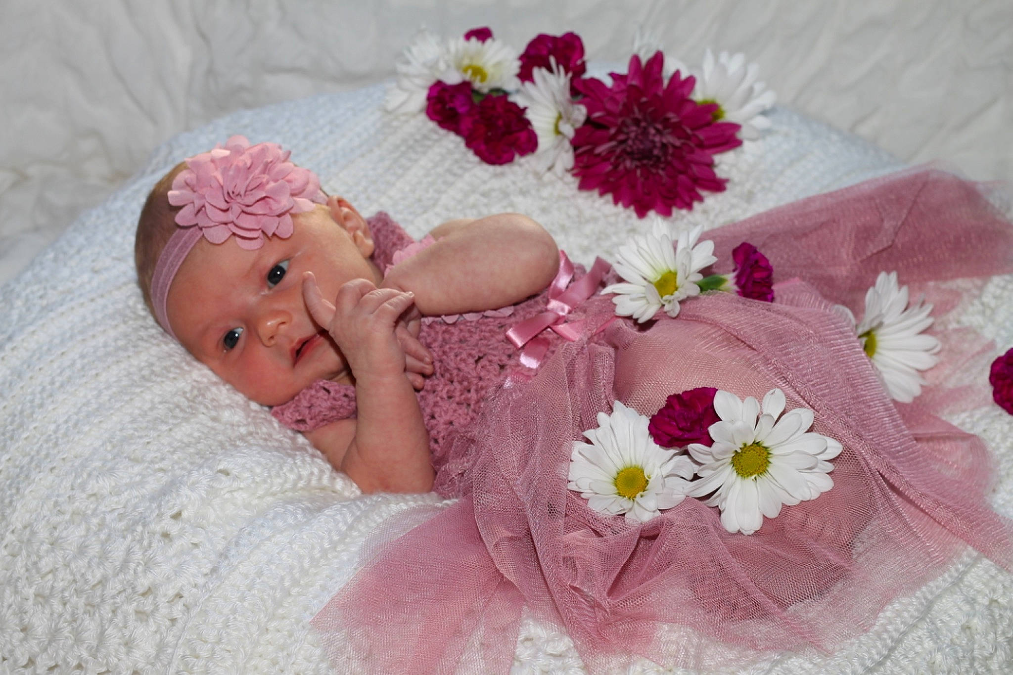 Henley joined the competition — help win amazing prizes! baby, baby_toddler_clothing, bedding, bridal_accessory, child, comfort, creative_arts, embellishment, finger, flower, hair_accessory, headgear, headpiece, headwear, linens, magenta, person, petal, pink, product