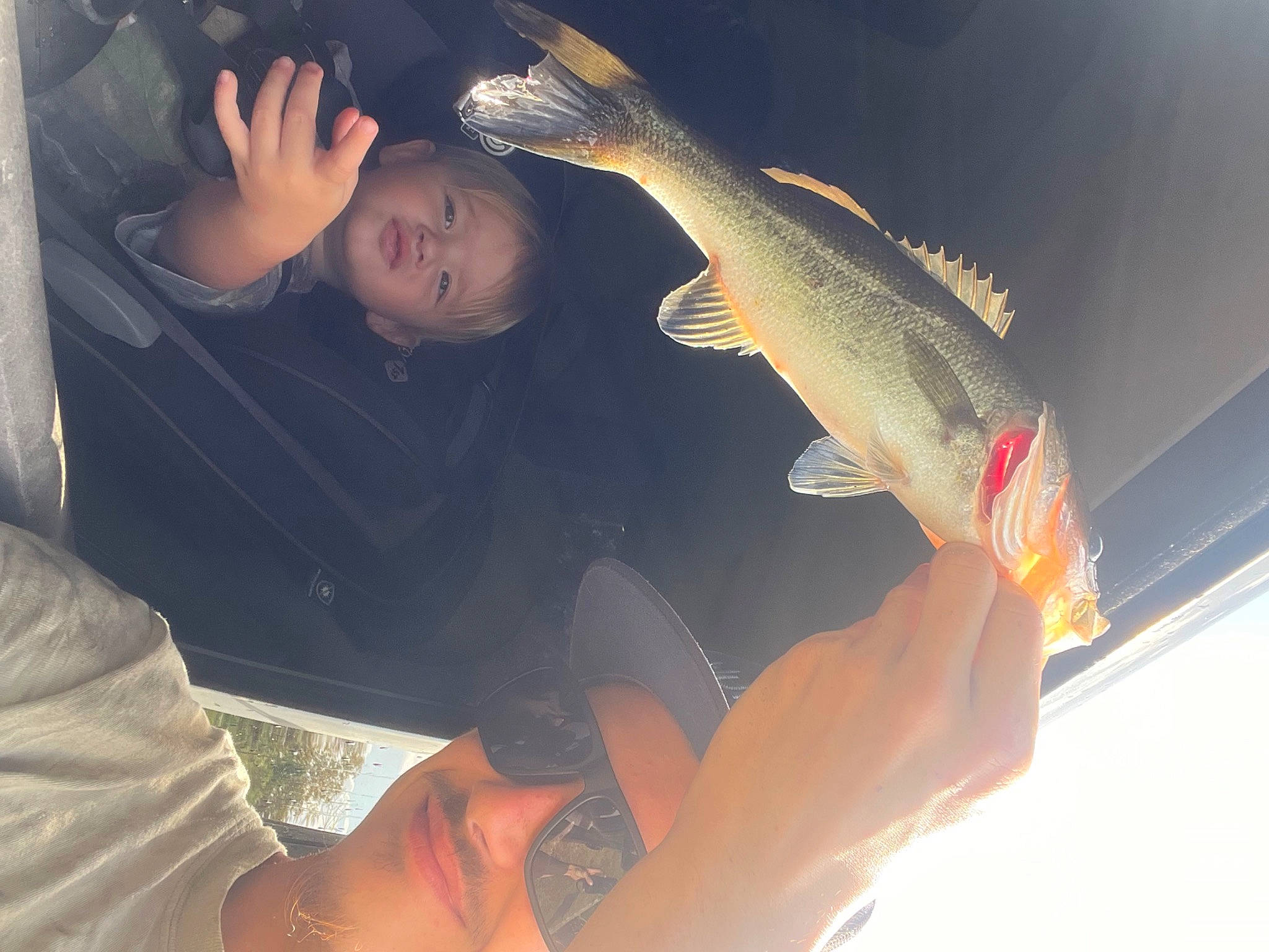 Kamden is registered to the contest to win money with this photo: bony_fish, cloud, cyprinidae, elbow, feeder_fish, fin, finger, fish, fisherman, fishing, gesture, hand, marine_biology, person, ray_finned_fish, recreation, recreational_fishing, seafood, t_shirt, tail