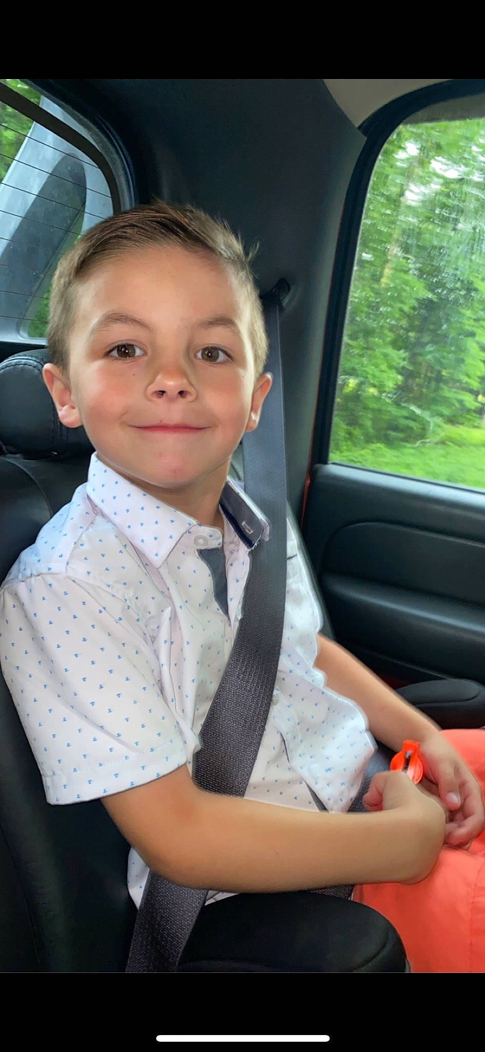 Kason is registered to the contest to win money with this photo: auto_part, car, car_seat, car_seat_cover, collar, dress_shirt, facial_expression, fun, gesture, happy, head_restraint, joy, motor_vehicle, person, seat_belt, smile, steering_part, steering_wheel, tie, vehicle