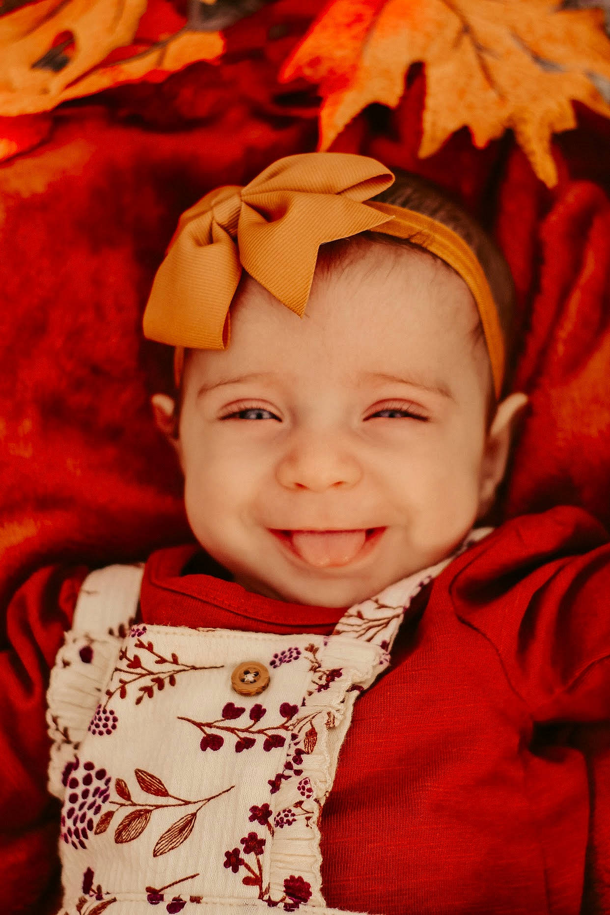 Avery is registered to the contest to win money with this photo: baby, cheek, child, face, headwear, joy, person, red, smile, toddler