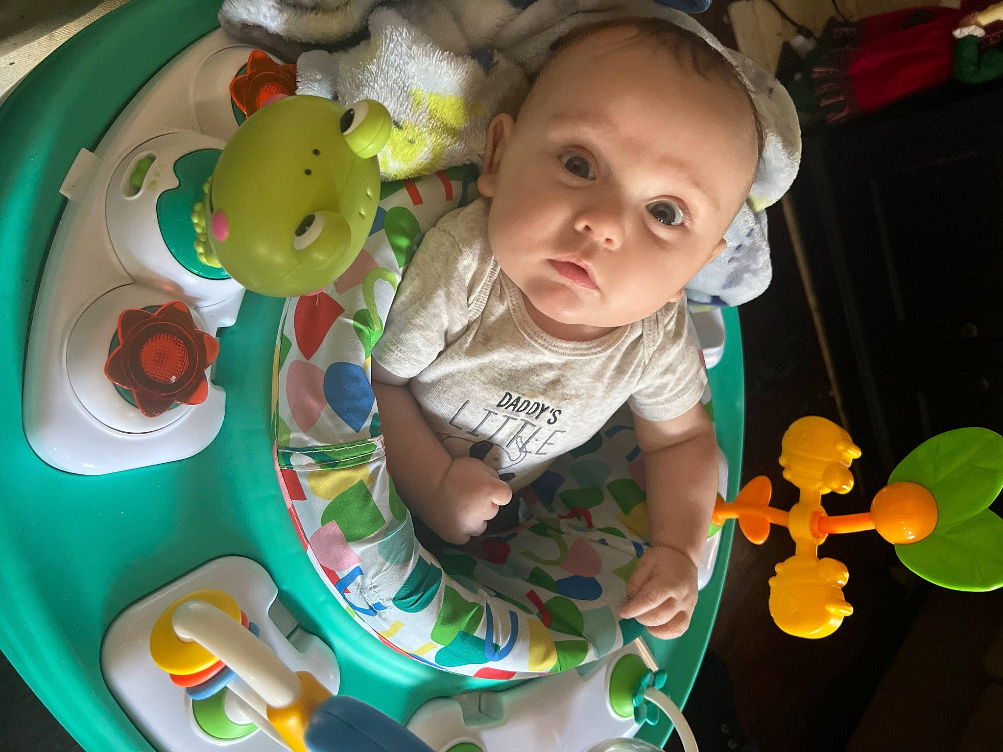 Jax joined the competition — help win amazing prizes! baby, baby_playing_with_toys, baby_products, baby_toddler_clothing, baby_toys, child, circle, fun, green, happy, pattern, person, play, room, sitting, t_shirt, toddler, toy