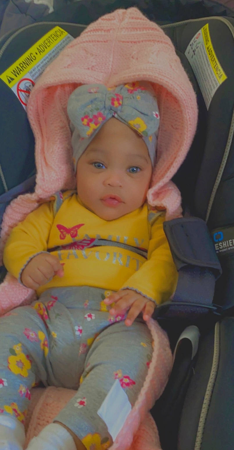 Nariah is registered to the contest to win money with this photo: baby, baby_carriage, baby_products, baby_toddler_clothing, beauty, chair, cheek, child, comfort, eye, face, fun, head, headwear, iris, lap, mouth, person, product, skin