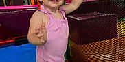 Kelsey is registered to the contest to win money with this photo: active, arms, baby, child, colorful, cute, fun, happy, indoor_playground, legs, netting, padded_mats, person, pink_outfit, play, play_area, safety, smiling, toddler, young_child