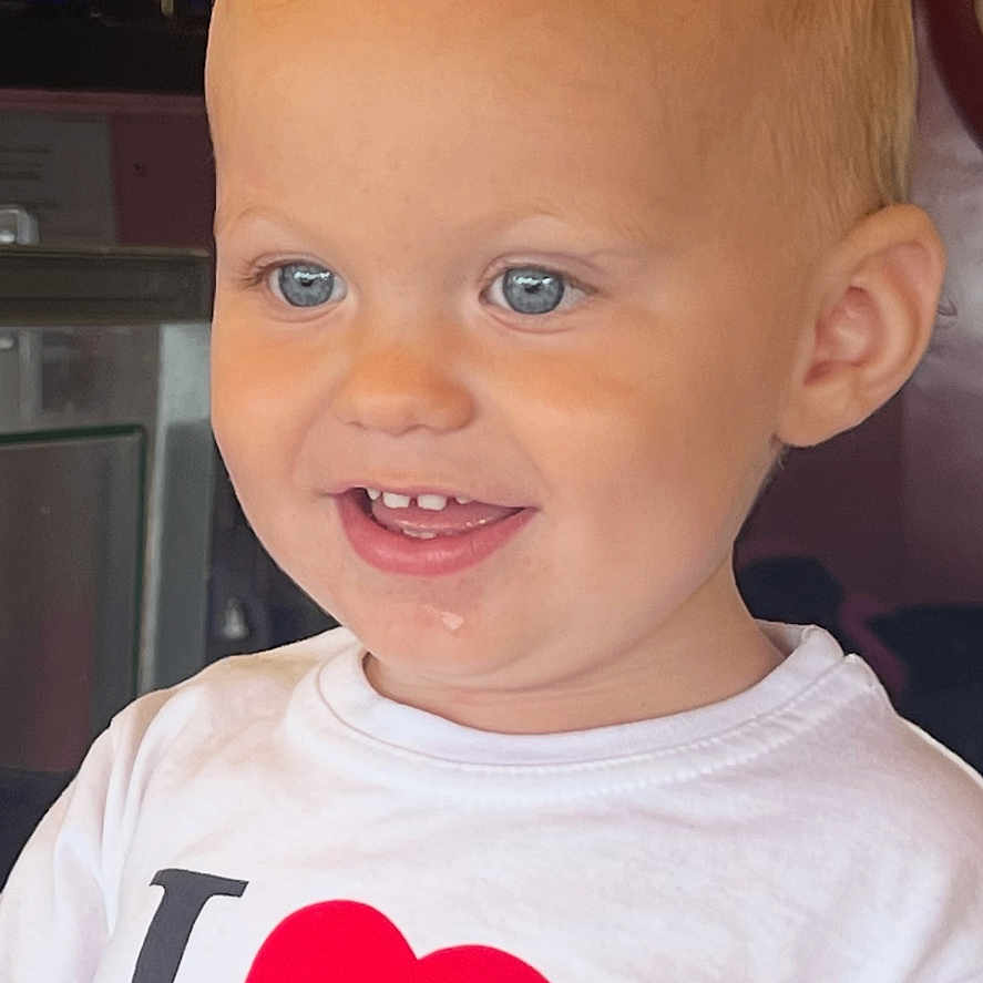 Edward joined the competition — help win amazing prizes! baby_teeth, blue_eyes, casual_clothing, child, close_up, cute, face, happy, head, heart_symbol, indoor, mouth, person, pizza, portrait, red_hair, skin, smiling, toddler, white_shirt
