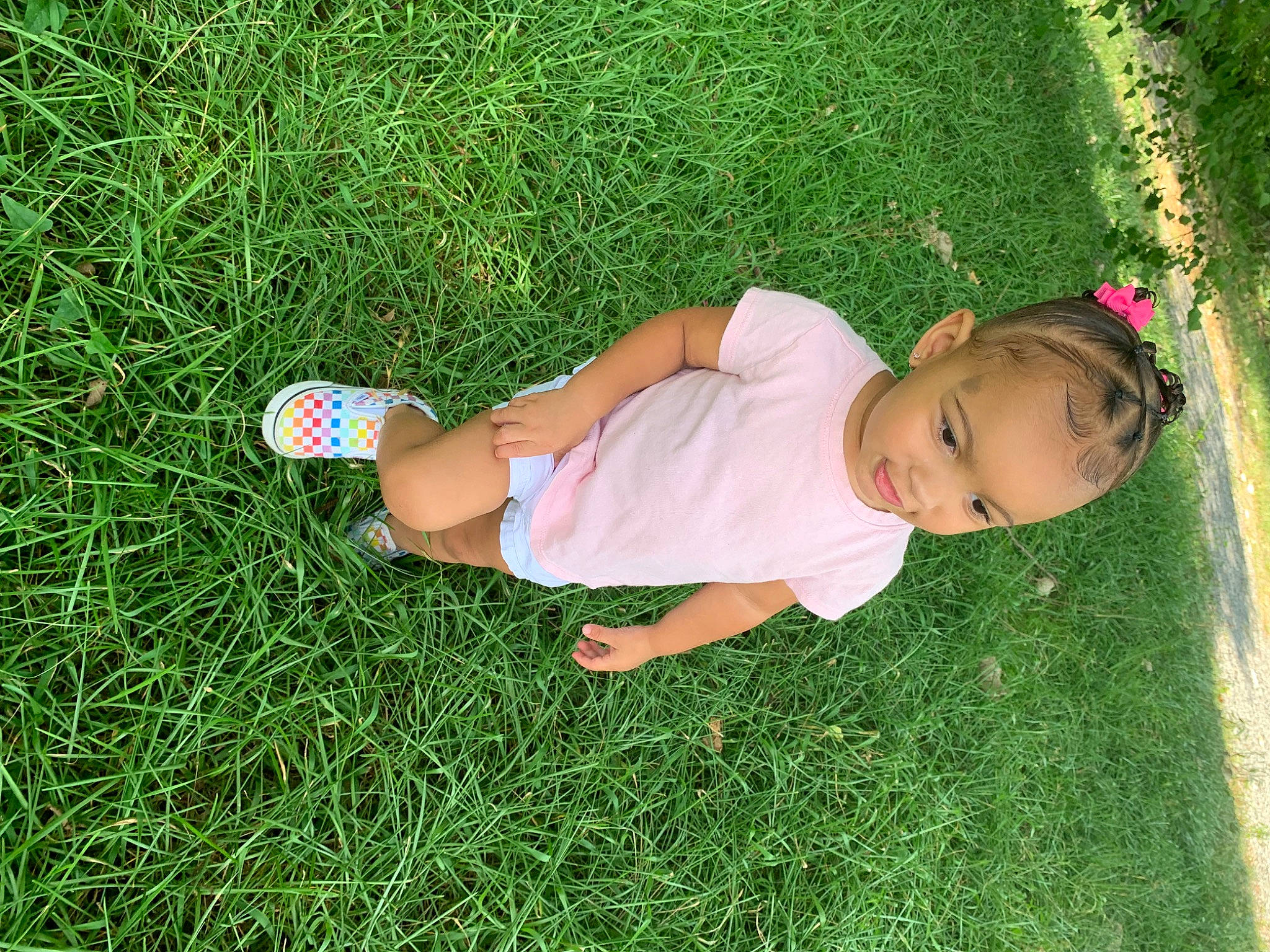 Nevaeh is registered to the contest to win money with this photo: baby, baby_toddler_clothing, finger, fun, grass, grass_family, grassland, green, groundcover, happy, human_body, lawn, leaf, leg, leisure, meadow, people_in_nature, person, petal, plant