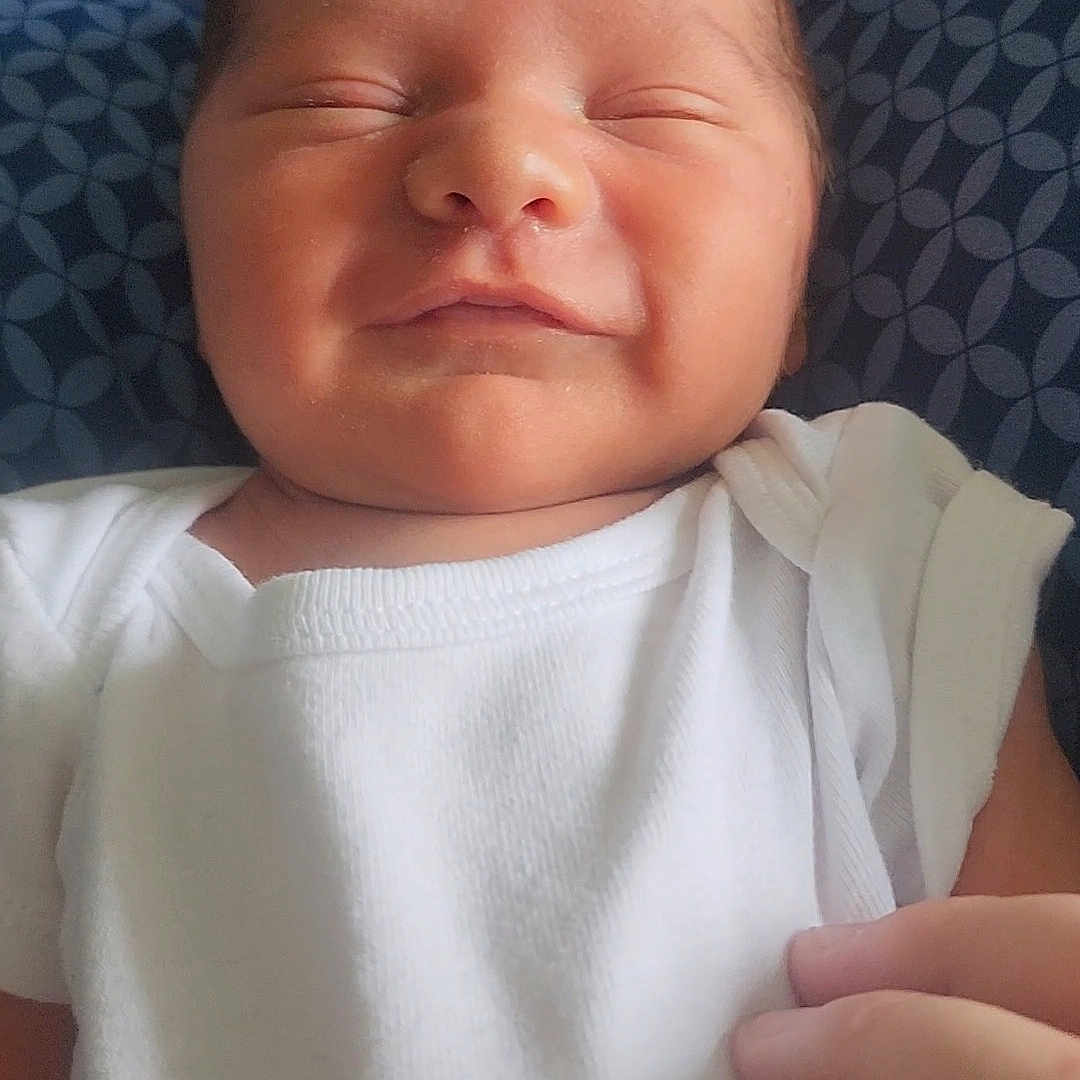 Azymondias joined the competition — help win amazing prizes! baby, child, closeup, cute, face, hand, indoors, infant, newborn, onesie, patterned_blanket, peaceful, person, portrait, resting, skin, sleeping, smiling, soft_light, white_clothing